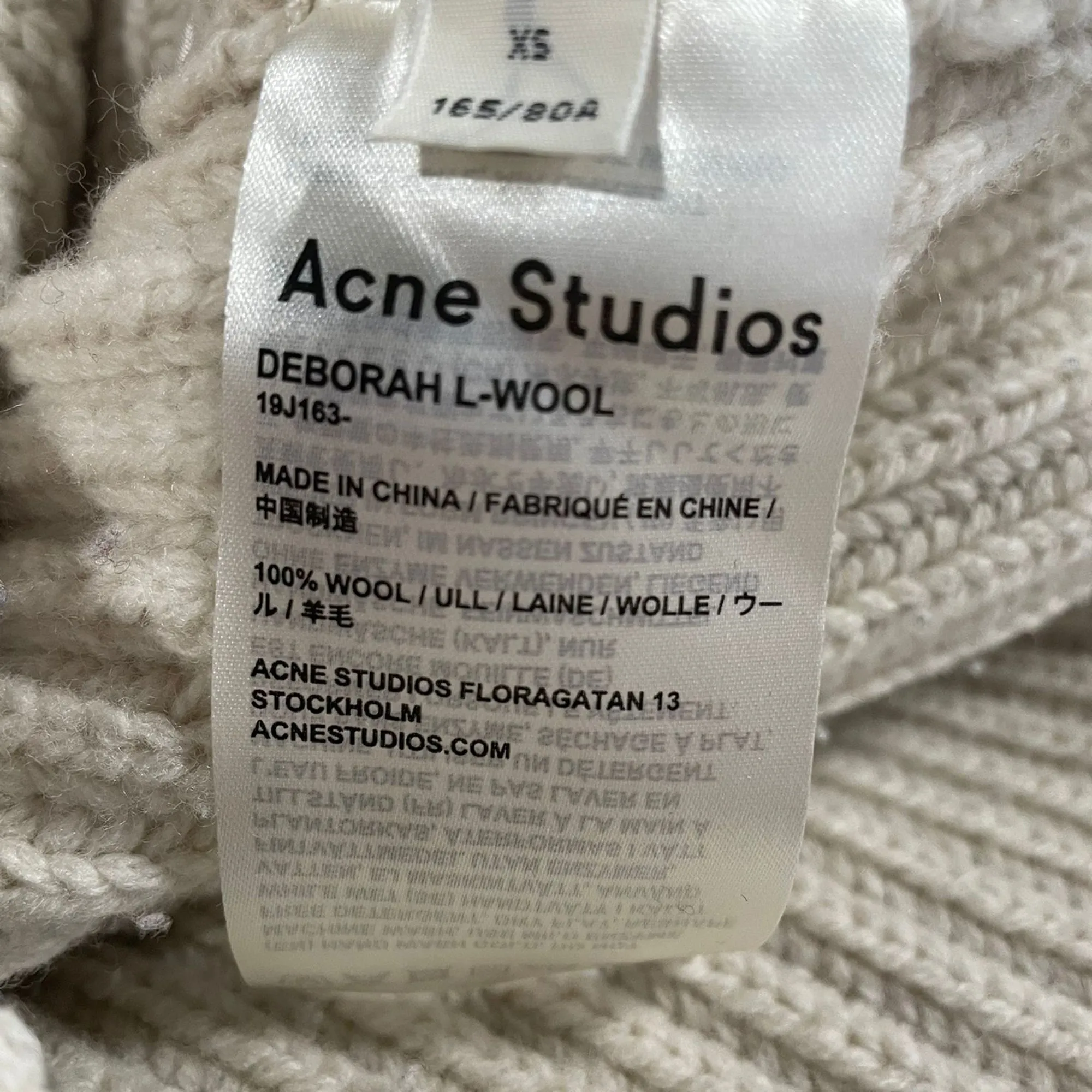 Pull tricoté en laine beige Acne Studios