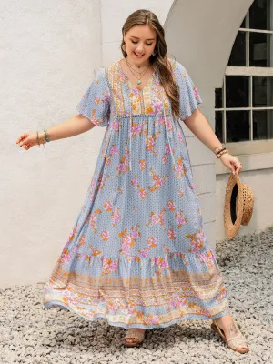 Robe longue à manches papillons et col noué imprimée pour grande taille